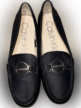 NWOT Calvin Klein Black Leather Slip-On Loafers with Silver Logo Accent